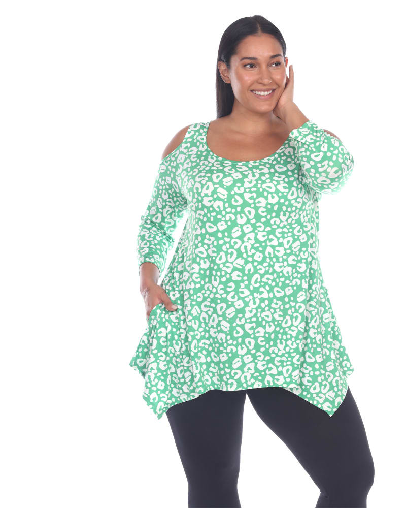 Front of a model wearing a size 1X Leopard Cold Shoulder Tunic Top in Green Leopard by White Mark. | dia_product_style_image_id:257690